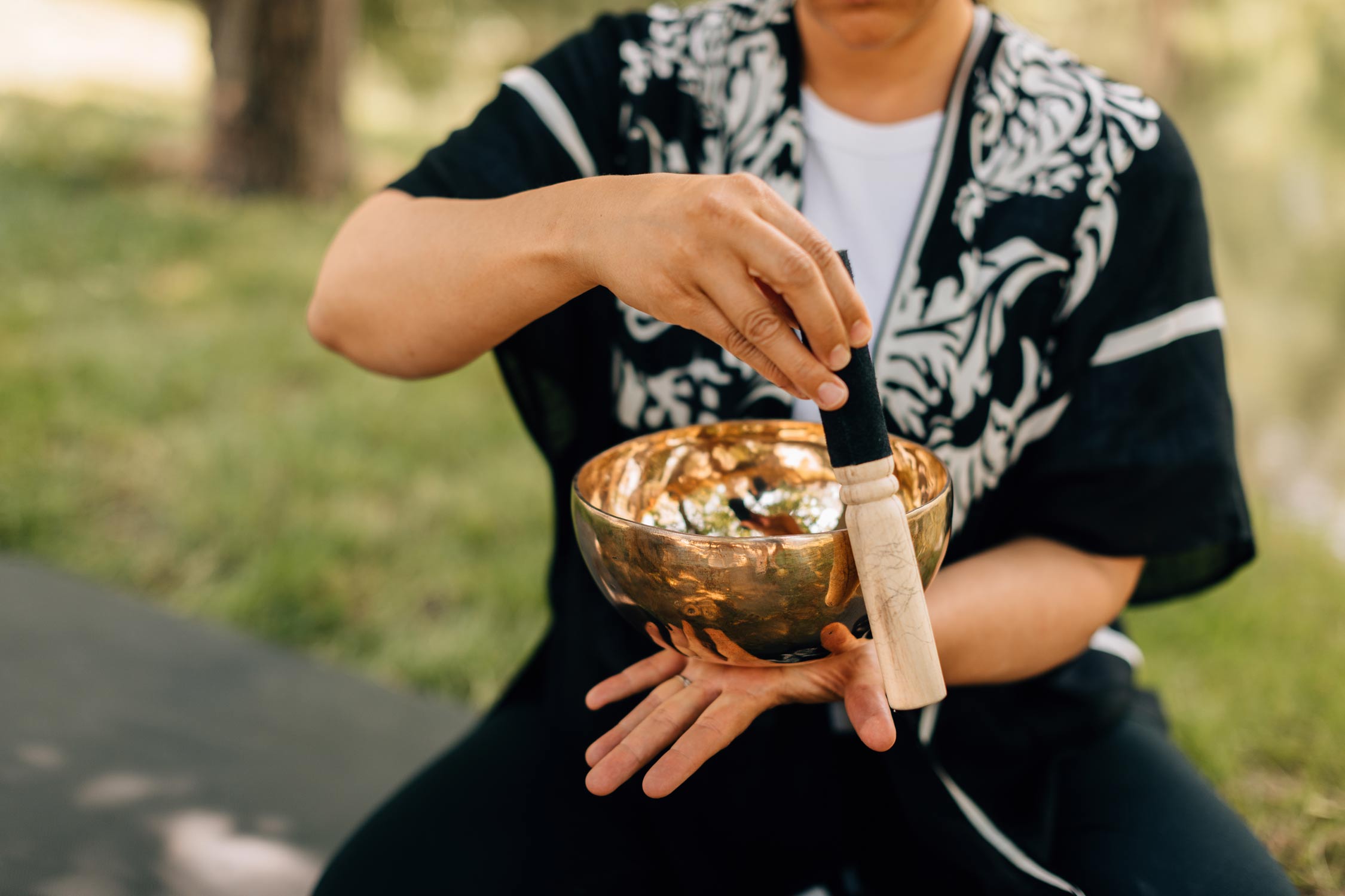 A man plays a singing bowl