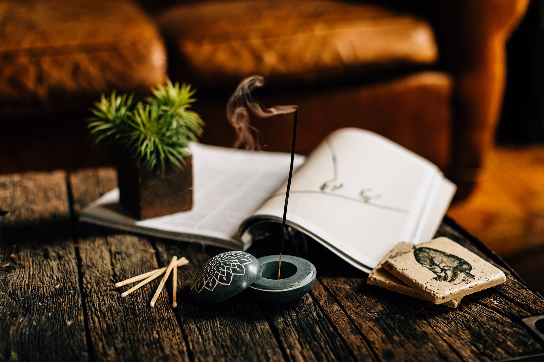 A fireplace burns in a cozy room.