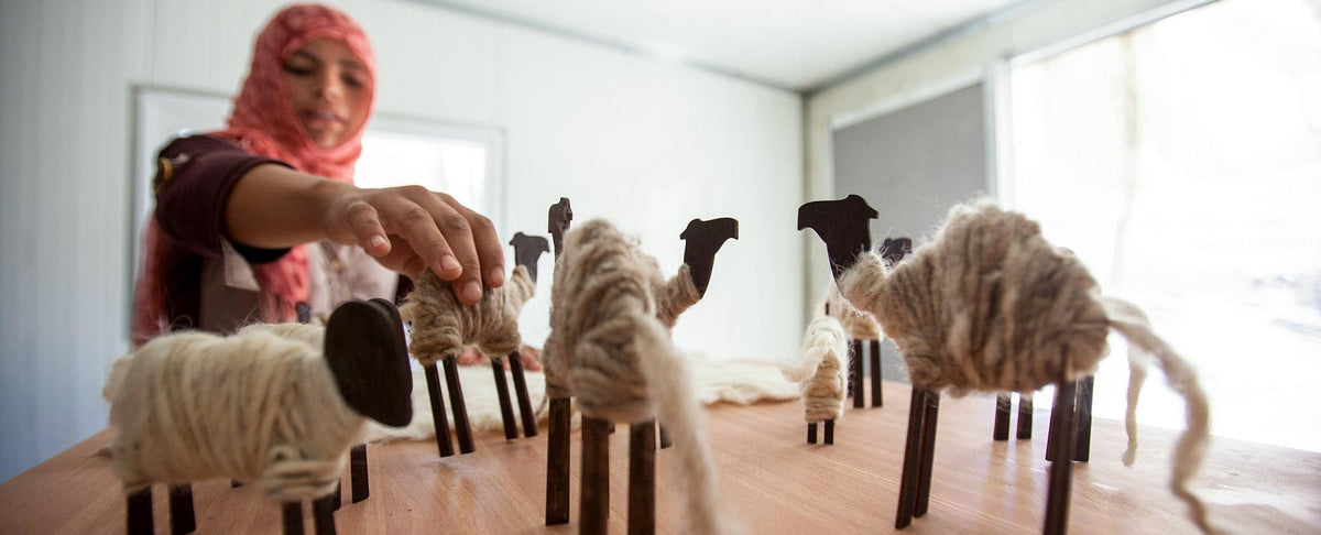 Female artisan from Kumbeshwar Technical School knitting