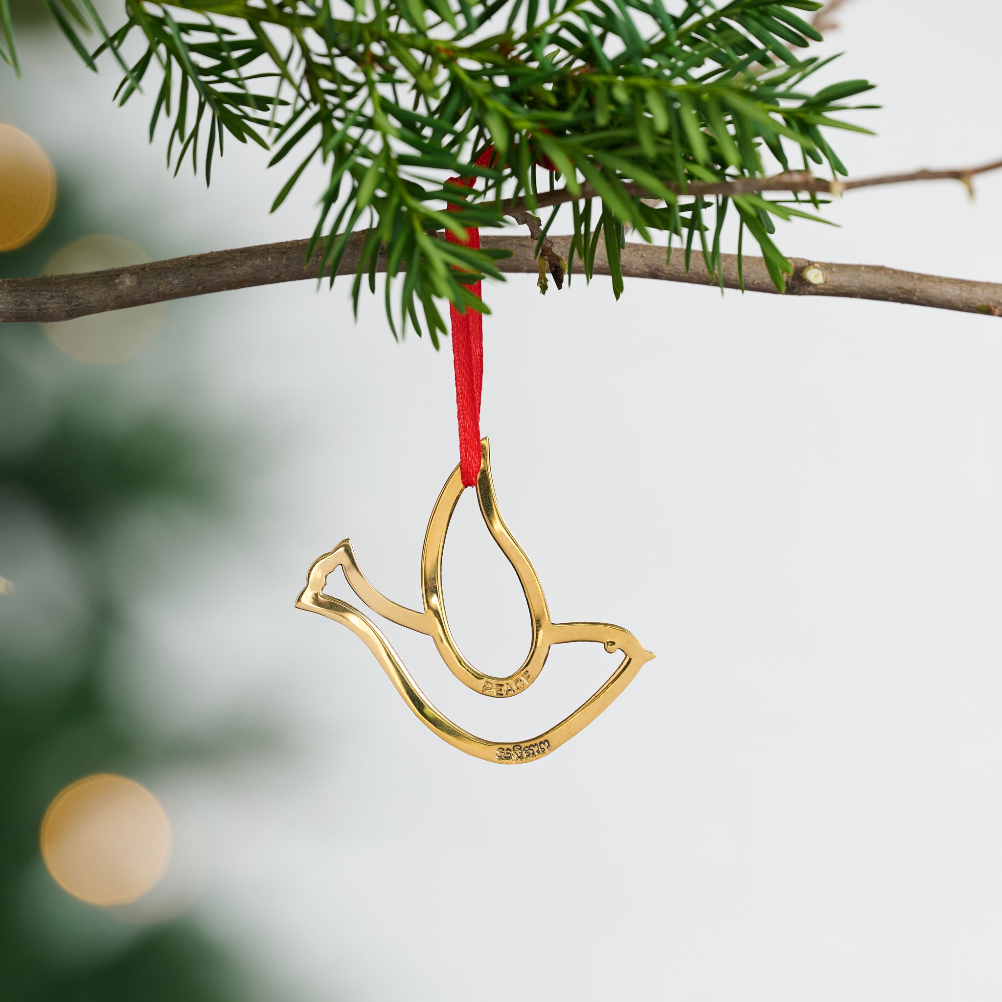 Dove of Peace Bombshell Brass Ornament - Ten Thousand Villages