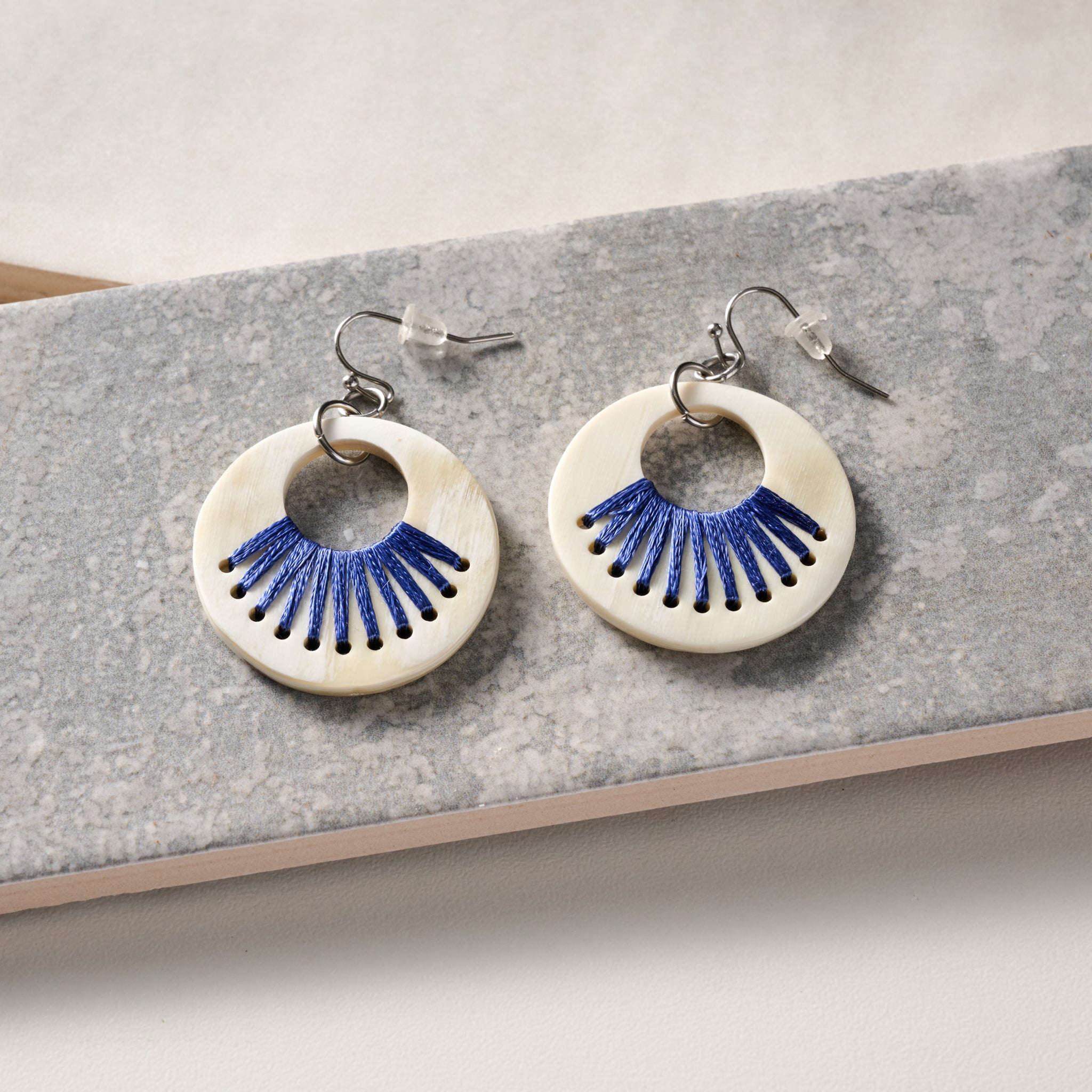 Taji Stitched Horn Earrings